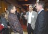 TALKING BUSINESS - Jay Lewis, from left, Craig Rivaldo and Don Schapp visit Friday before the business forecast lunch at the John Q. Hammons Center in Rogers.
