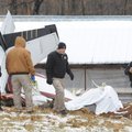 Officials with the Washington County Sheriff's Office collect information at the site of a plane cra...