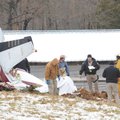  Officials with the Washington County Sheriff's Office collect information at the site of a plane cr...