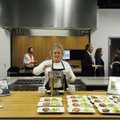 Lisa Clayton, culinary team member with Tyson Foods, serves a bowl of tomato basil soup Friday durin...