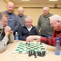 FULL ATTENTION - A Bella Vista Chess Club game between Jim Jensen, left, and Bud Brebner draws an au...