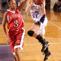 Fayetteville senior guard Sierra Shipley shoots over Fort Smith Northside junior guard Chatara Roger...