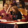 Elkins cross country standout Grace Heymsfield dons a University of Arkansas hat Friday after signin...
