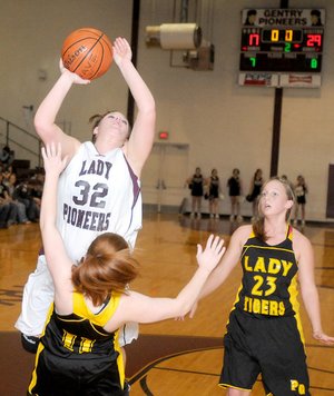 Gentry’s Terra Jones shoots over Prairie Grove’s Morgan Abernathy on Friday in Gentry.