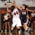 Rogers Heritage’s Danielle Schillinger knocks the ball away from Springdale High’s Baylea Swearingen...