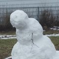 WINTER DEPRESSION - A snowman appears to hang its head Friday as snow melts away in a front yard at ...
