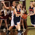 Springdale’s Tiffany Wiseley defends Rogers Heritage’s Danielle Schillinger as she passes the ball t...