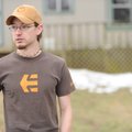 Chris White answers questions outside his home along Oak Grove Road after witnessing the crash of a ...