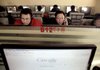 Customers use the computers at an Internet cafe in Beijing, where Google’s future is in question.