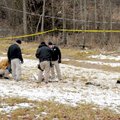 Officials with the Washington County Sheriff’s Office collect information Saturday at the site of a ...