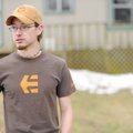 Chris White answers questions outside his home along Oak Grove Road after witnessing the crash of a ...