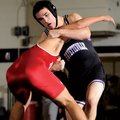 Fayetteville’s Cameron Baker gets a hold on Fort Smith Northside’ Victor Chavez during their 152-pou...