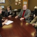 COMMUNITY CHRISTMAS CARD - Vicki Thomas, Fayetteville schools superintendent, from left, Anita Scism...