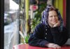 Opal Fly, owner of Opal Fly’s Feel Good Lounge, sits for a portrait Tuesday in Fayetteville.
