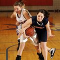 Springdale George’s Callie Harris, left, and Springdale Southwest’s Anna Hudgeons battle for possess...