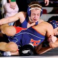 Rogers’ Jake Humphries, top, fights to get Rogers Heritage’s Francisco Simental onto his back during...