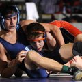 Rogers Heritage’s Paxon Fowler, right, wrestles against Springdale Har-Ber’s Antonio Guerrero on Feb...