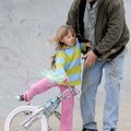 OFF BALANCE - Bob Carruthers reaches Sunday to catch his daughter Maggie Carruthers, 7, as she loses...