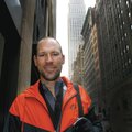 The Empire State Building is seen in the background as former Rogers resident Neal Andrews stands on...