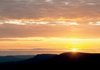A sunrise over Round Top Mountain.
