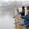 Edward Johnson, from left, Eddy Burwell and his father, Harvey Burwell, fish Monday for trout at the...