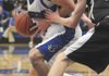 Rogers High’s Casey Caton, left, tries to drive around a Bentonville defender during Friday’s game in Rogers.
