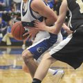 Rogers High’s Casey Caton, left, tries to drive around a Bentonville defender during Friday’s game i...