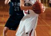 Springdale High senior forward Joseph Kellogg, right, grabs a rebound in front of Springdale Har-Ber’s Chris Bayles during the fourth quarter of Saturday’s game in Springdale.

