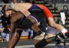Rogers Heritage’s Conor Bolton works to get Fayetteville’s Devin Bowers to the mat Saturday during their 215-pound finals match at the Fayetteville Invitational wrestling tournament at Fayetteville High School.
