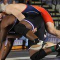 Rogers Heritage’s Conor Bolton works to get Fayetteville’s Devin Bowers to the mat Saturday during t...