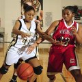 Bentonville’s Essence Baker fights for a loose ball against Fort Smith Northside’s Taylor Green duri...