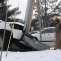 TWO-CAR ACCIDENT - A crew from Ozarks Electric Cooperative assesses the situation after a two-car ac...