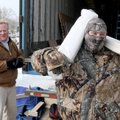 SPRUCING UP THE PARK - Nicholas Shockley carries wrapped parts Tuesday for new displays for Pea Ridg...