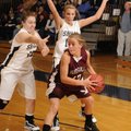 Huntsville’s Taylor Grigg looks to pass as Shiloh Christian’s Jesse Parks, left and Christian Reed, ...