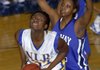 North Little Rock's ** Williams (32) looks to make the shot as Conway's Krista Robinson (32) tries to block from behind Thursday night at North Little Rock High School.