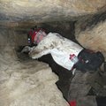  Tim Scott, Devil’s Den State Park assistant superintendent, works through one of the roomier parts ...