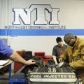 Davone Valentin, right, assembles a double flair on a metal brake line Wednesday as Johnnathan Carr,...