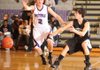 Fayetteville’s Jack Jones, left, provides defensive pressure as Bentonville’s Nick Michael fires a bounce pass during the first half of Thursday’s game in Fayetteville.