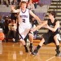 Fayetteville’s Jack Jones, left, provides defensive pressure as Bentonville’s Nick Michael fires a b...