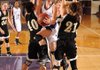 Fayetteville’s Sierra Shipley, center, leaps between Bentonville defenders Blaklee Sanders, left, and Emily Spencer for a shot during the first half of Thursday’s game in Fayetteville.

