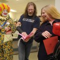 SPREADING CHEER- Steve and Lucy Cole, right, of Branson, Mo., look Thursday at a Valentine card deli...