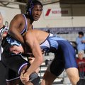 Springdale Har-Ber’s Antonio Guerrero, right, works to get Fayetteville’s Deshun Thomas to the groun...