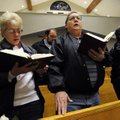 MEMORIAL SERVICE - Barbara Postert, left, Stephen Postert and Mary Salnicki, all of Omaha, Neb., sin...