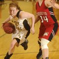 Prairie Grove’s Morgan Abernathy, left, drives the lane Friday while Farmington’s Anna Oxford defend...