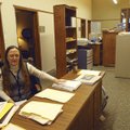 Desk clerk Josephine Barry works among disp laced office furniture and equipment that had to be move...