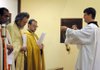 Josh Kellam, right, anoints the Rev. John Antony of St. Joseph Catholic Church, from left, the Rev. John Atchison of St. Nicholas Antiochian Orthodox Church and the Rev. John Slavin of St. Gabriel’s Anglican Church with incense during an ecumenical prayer service at St. Gabriel’s in Springdale on Feb. 5.
