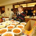 SOUPER BOWL - Nick Cross, 11, distributes bowls of chicken noodle and taco soup during the Souper Bo...
