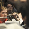 WIND POWER - Lindsey Minor from Lingle Middle School in Rogers plays the flute Friday during the All...