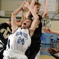 NARROW DEFEAT - Bentonville senior forward Jon Koonce grabs a rebound behind Springdale Har-Ber juni...