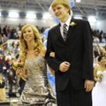 WILDCATS COLORS DAY - Senior Maid Kelsey Taylor, 18, is escorted Friday out of the Springdale Har-Be...
